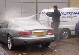 Aston Martin receiving high pressure spray wash