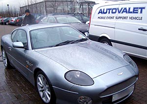 Aston Martin receiving high pressure spray wash